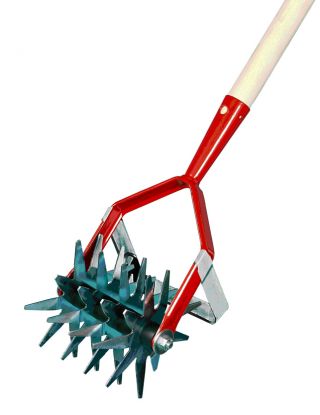 Tiller with a weeder on a handle